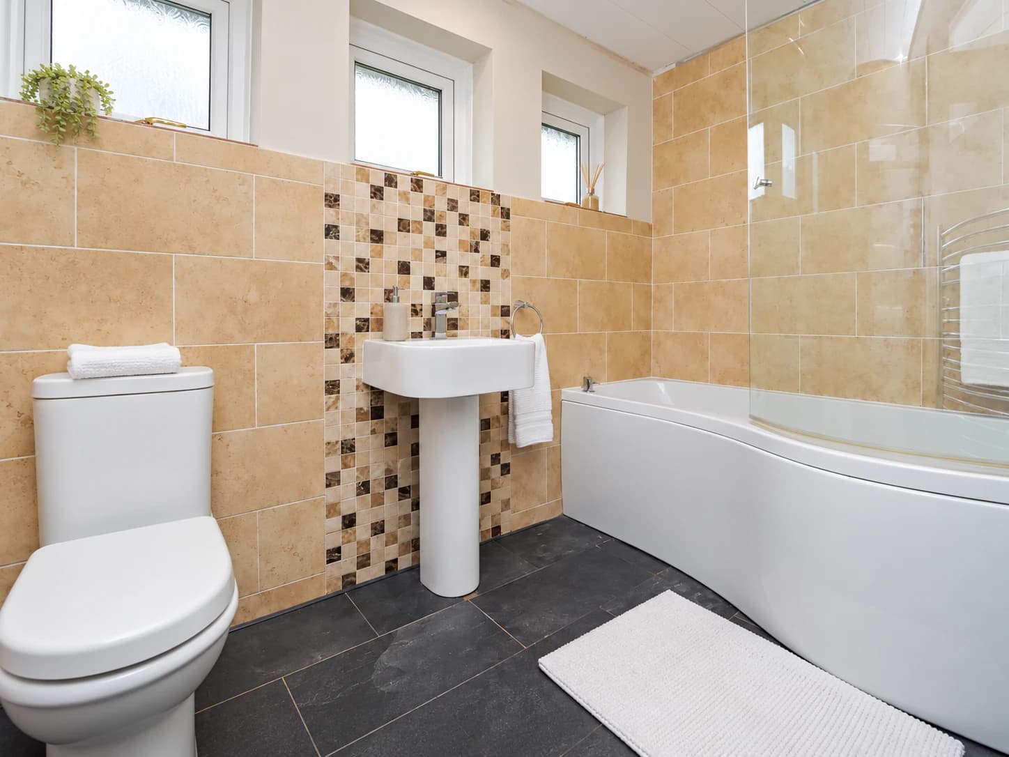 Family bathroom with bath and shower at Sherburn